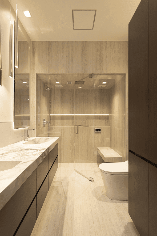 Bathroom with a long floating vanity and a glass shower