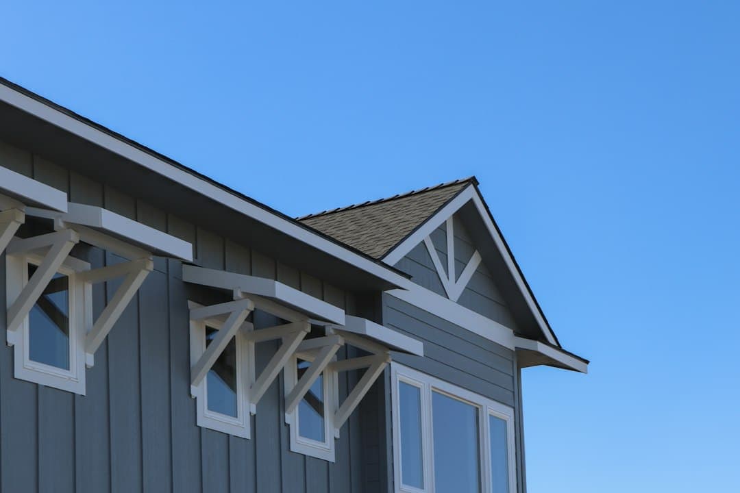 dark gray siding with wood accents